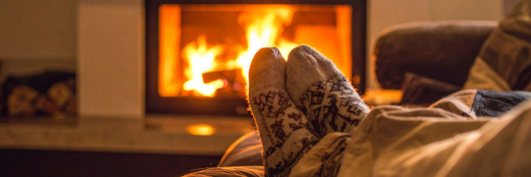 warming-up-by-fireplace